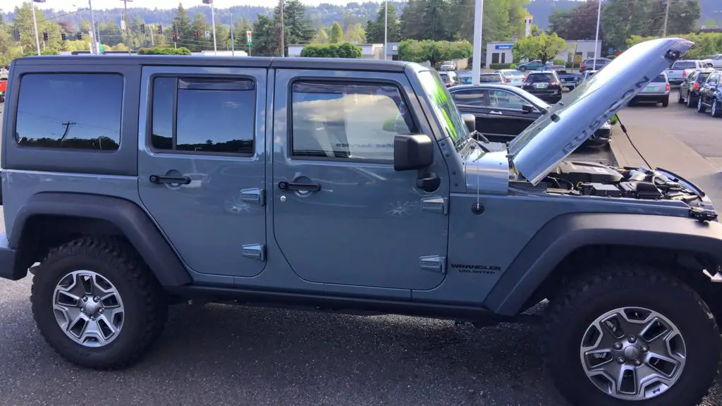 A jeep wrangler rubicon with the hood up