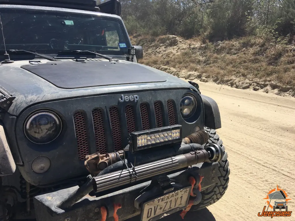 Front Drive Shaft Zip Tied to Jeep Bumper