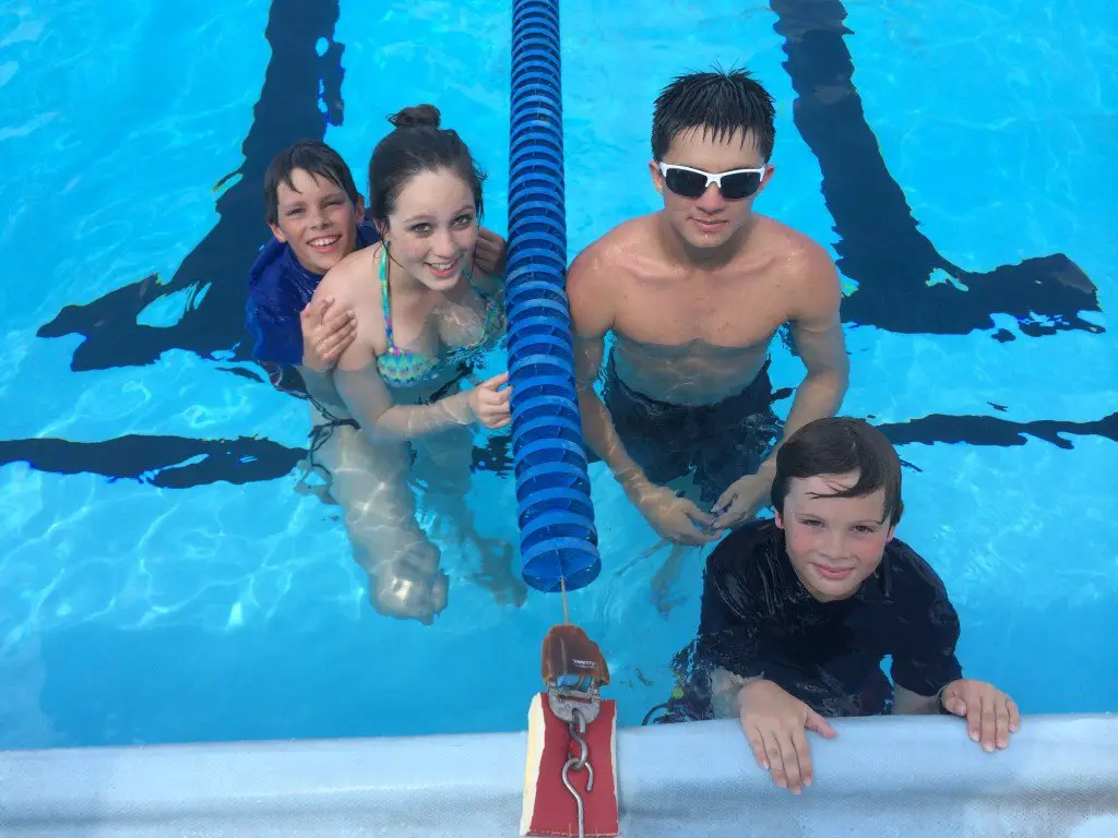 Javen, Arianna, Darius and Silas Highland in the pool at NAS Whiting Field. 