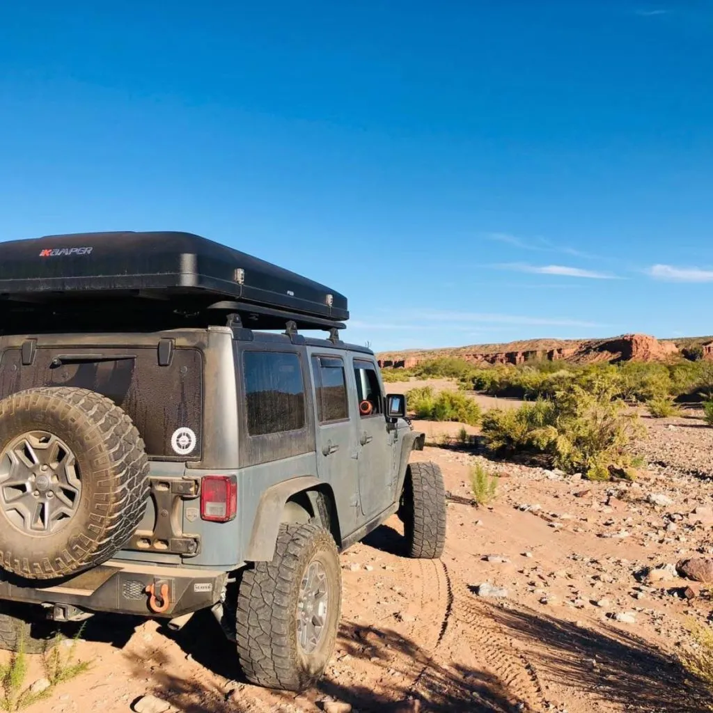 Jeep Rubicon Off-roading With Rooftop Tent