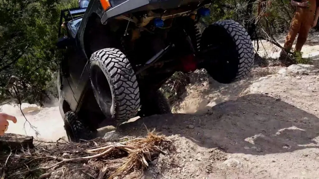 A Jeep doing a wheelie at Hidden Falls Adventure Park