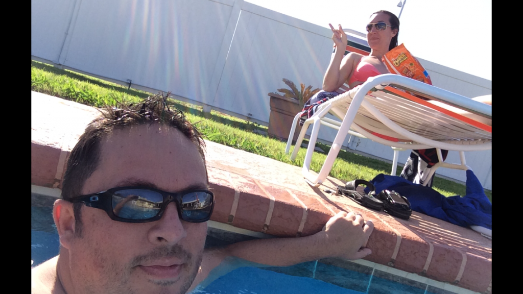 Eric and Brittany of RV Wanderlust at the pool at Austin Lone Star Carefree RV Resort